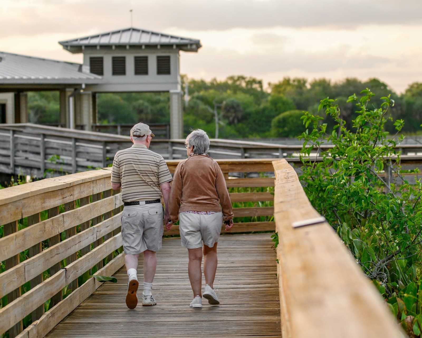 A couple in their 60s walking together outdoors